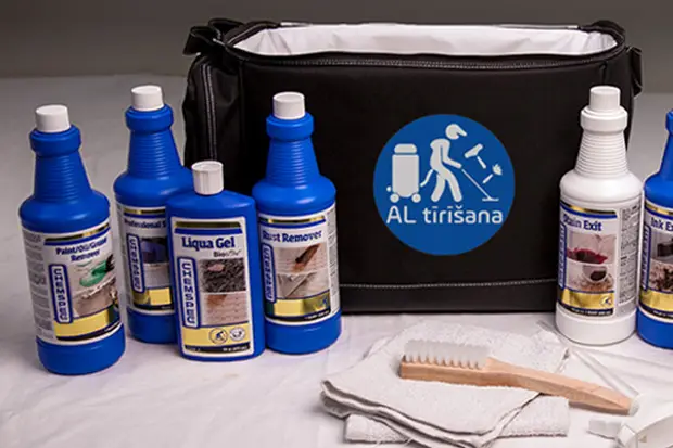 a group of bottles and a brush next to a bag